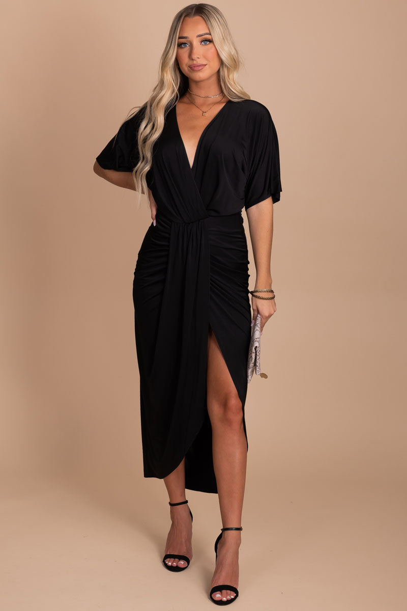 black faux wrap midi dress with thigh high slit in the front