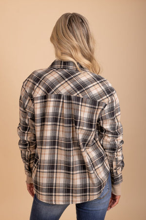 womans button up collared brown and black flannel