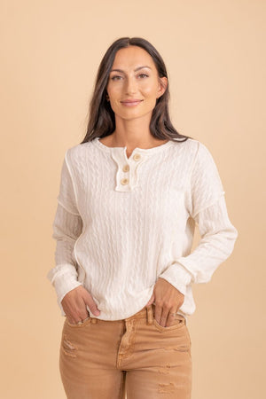 white cable knit long sleeve sweater