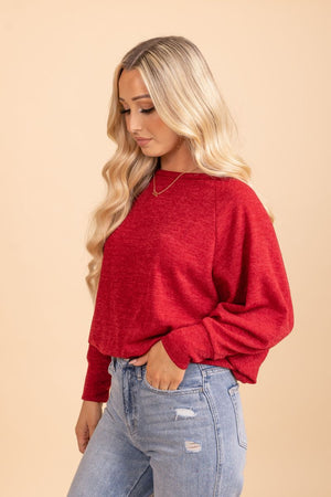 red cinched waist long sleeve top 