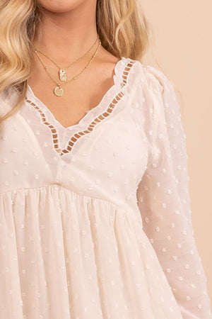 v neckling swiss dot white mini dress