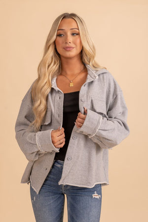 womans gray distressed button up jacket