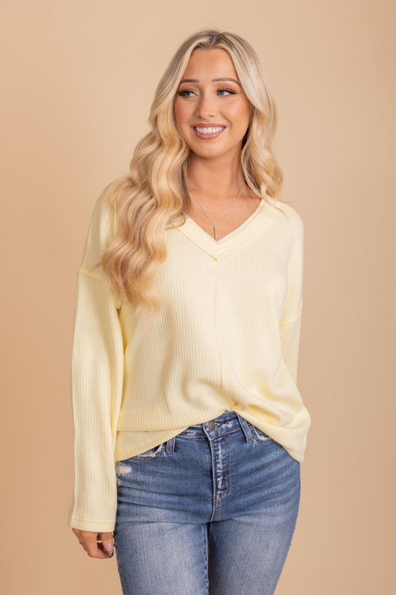 yellow long sleeve knit top