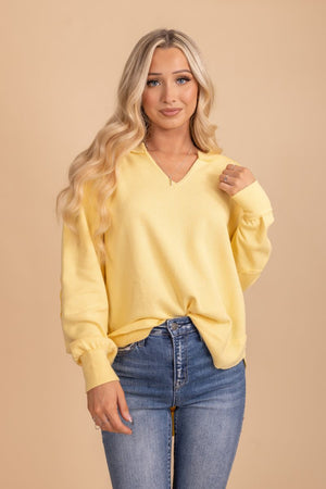 yellow v neck long sleeve top