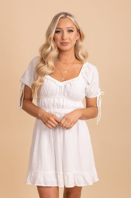 white rounded v neck mini dress