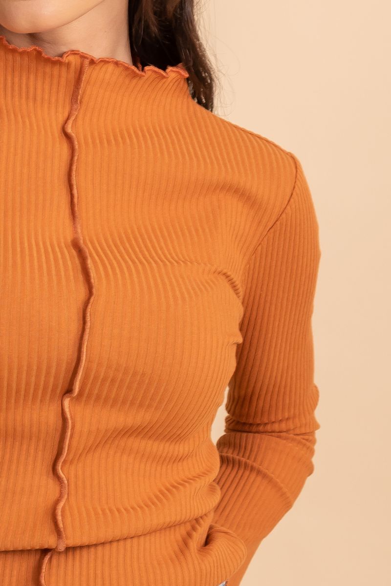 orange front seam long sleeve top