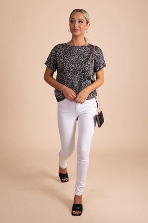 short sleeved black and white patterned blouse