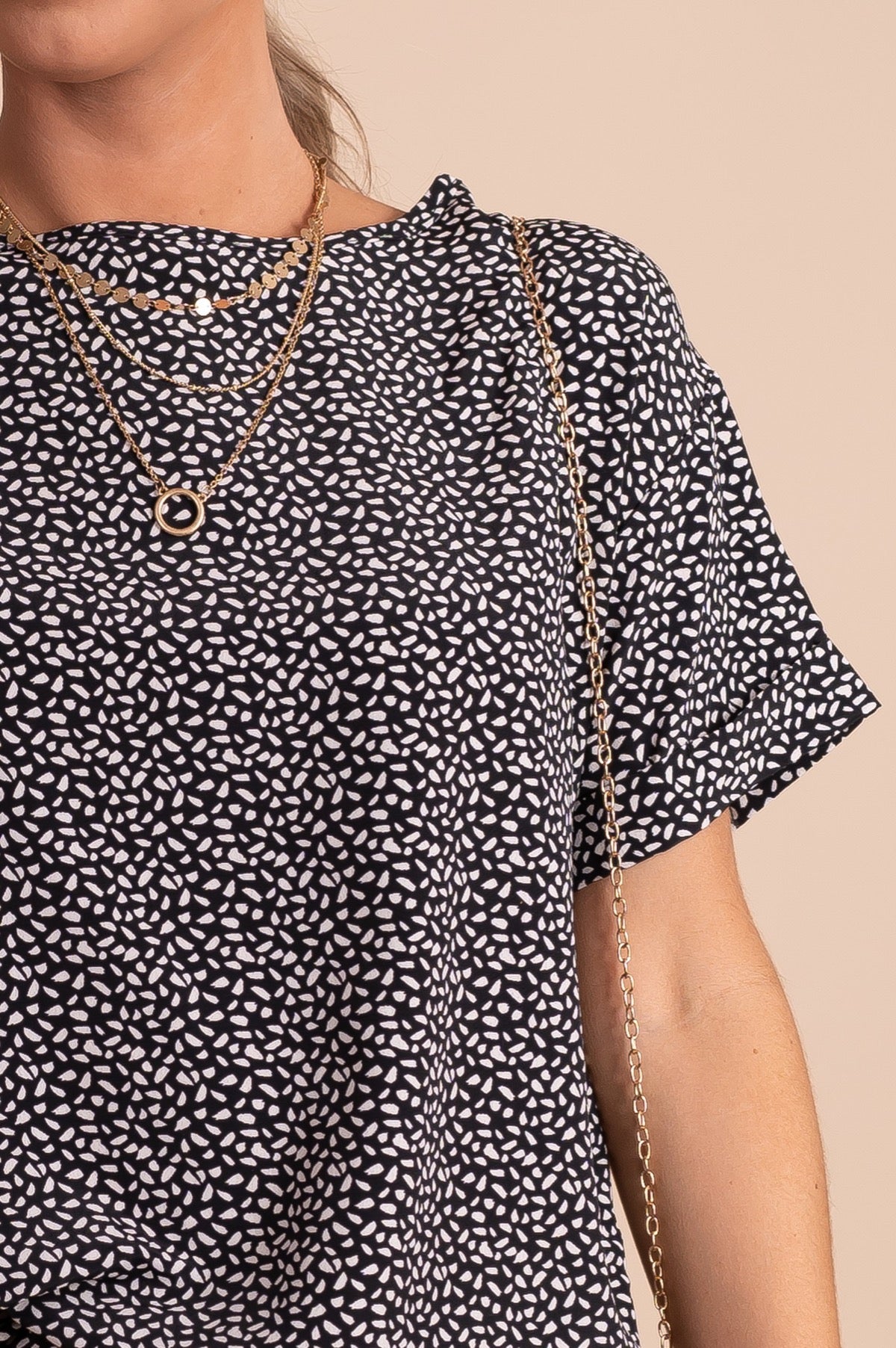 black with white speckled patterned top