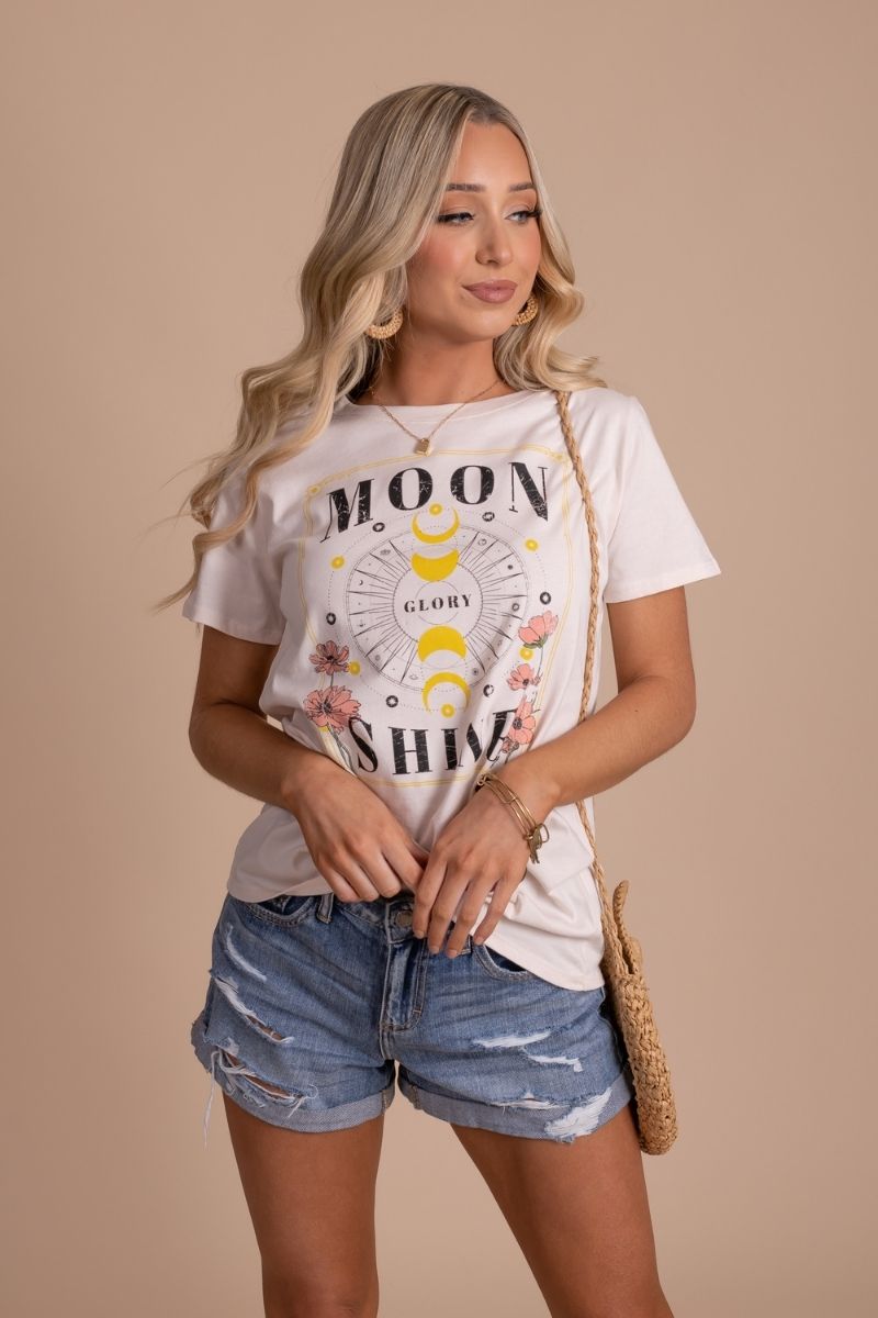 women's boho graphic tee with "moon shine glory" lettering and moon and sun graphics