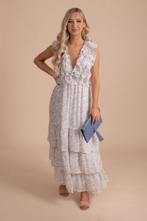 white maxi dress with floral print and ruffled sleeves