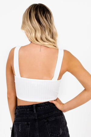 back of white crop top with black shorts