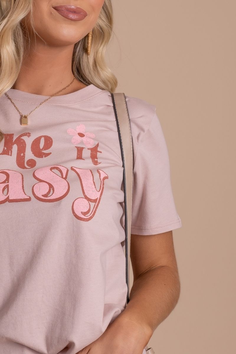 women's summer graphic tee retro vibe with "take it easy" lettering and floral accent graphicwomen's summer graphic tee retro vibe with "take it easy" lettering and floral accent graphic