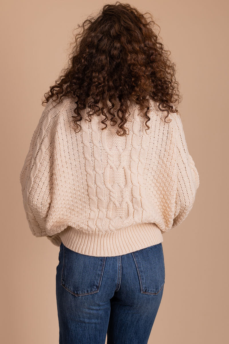 women's cream cableknit sweater