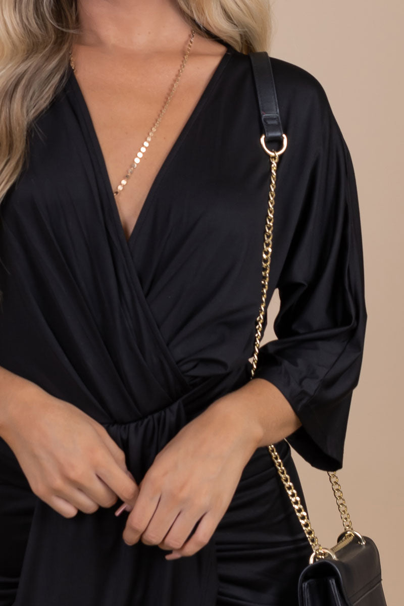 women's black v-neck midi dress with faux wrap top