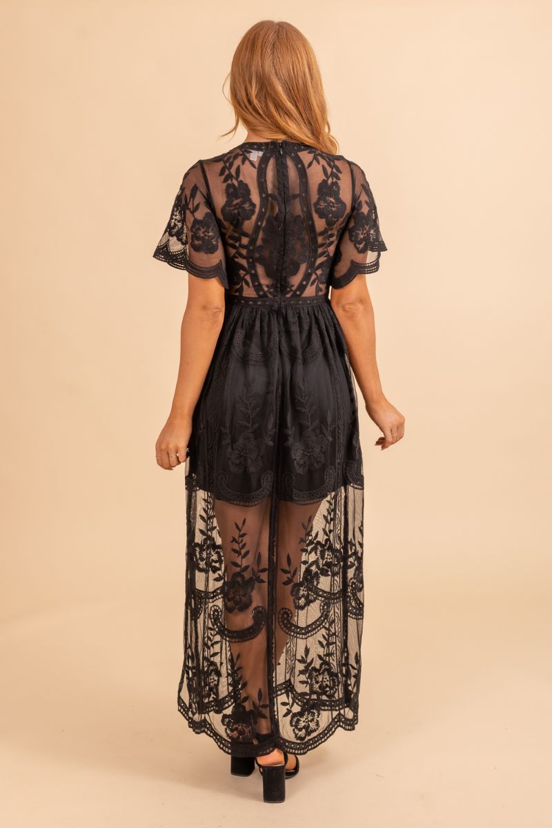 Womans black event dress with sheer open lace
