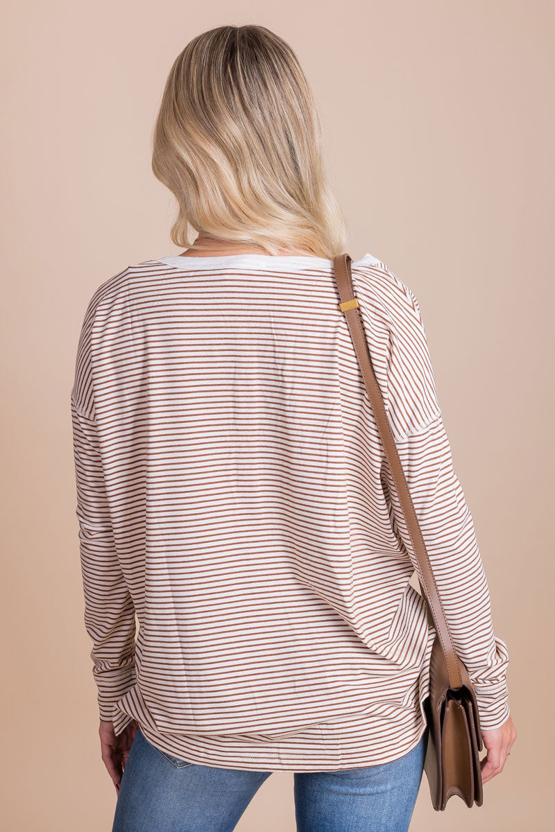 women's striped brown and white long sleeved henley top