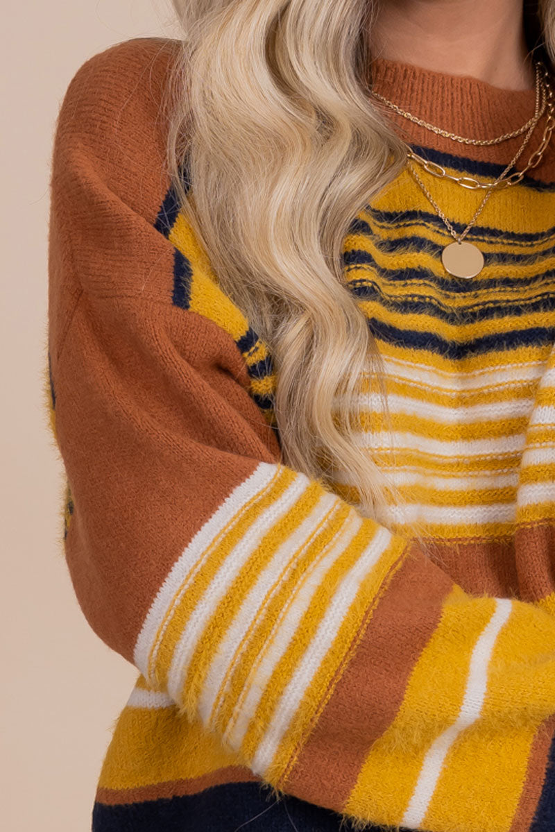 Sweater with Orange, Yellow, Cream, and Black Stripes