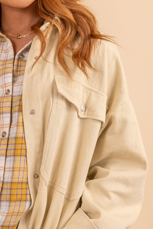 Cream woman's button up front pocket jacket