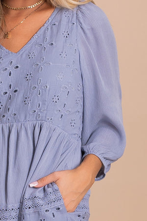 women's light blue maxi dress with long sleeves and an open back