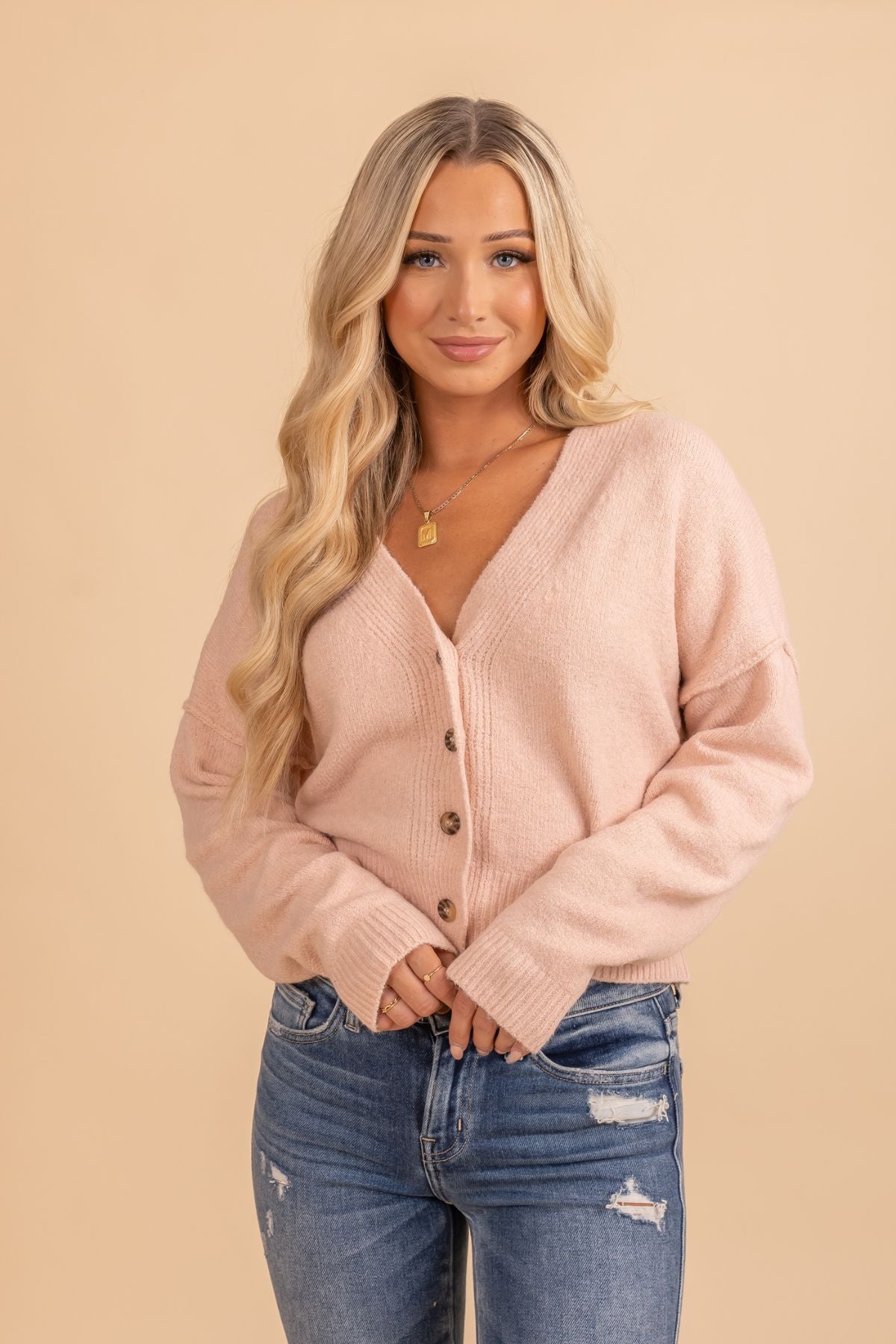 Pink long sleeve button up sweater