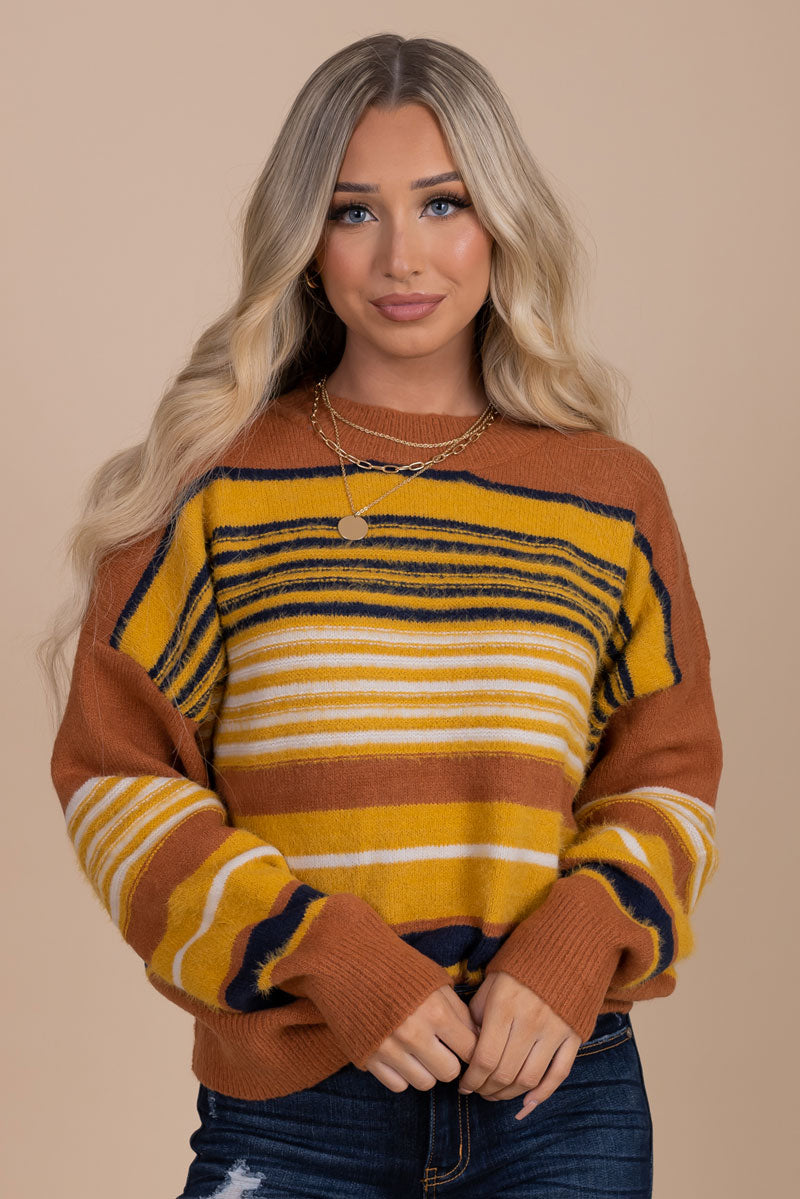 Orange and store yellow striped sweater