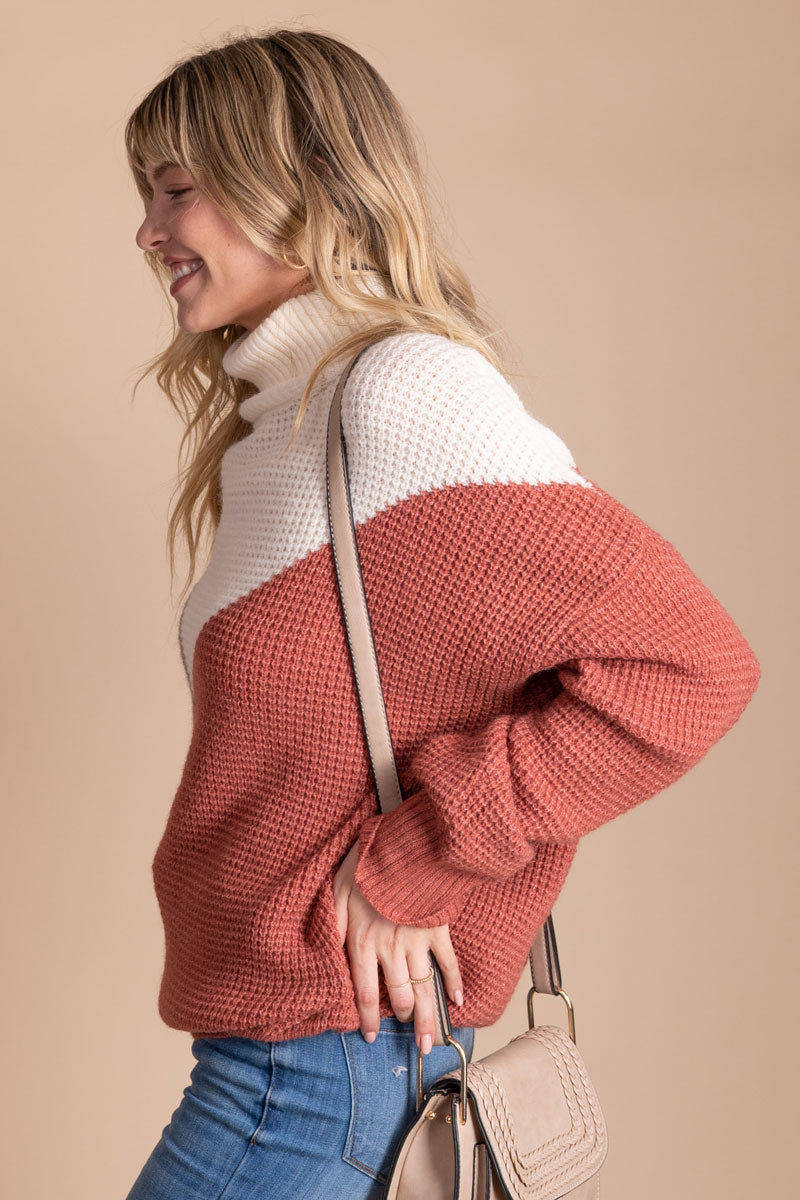 women's pink, white, and gray fall sweater