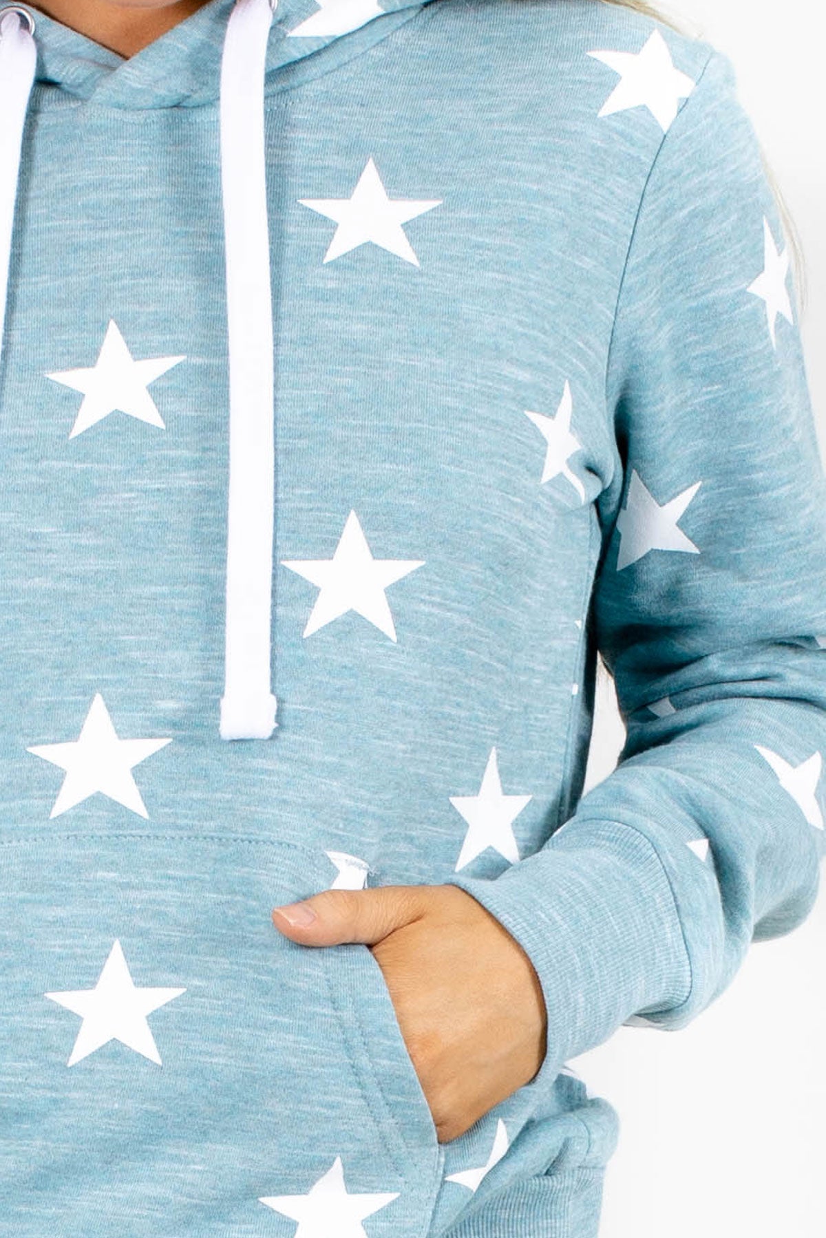 blue women's hooded top with pockets and star pattern