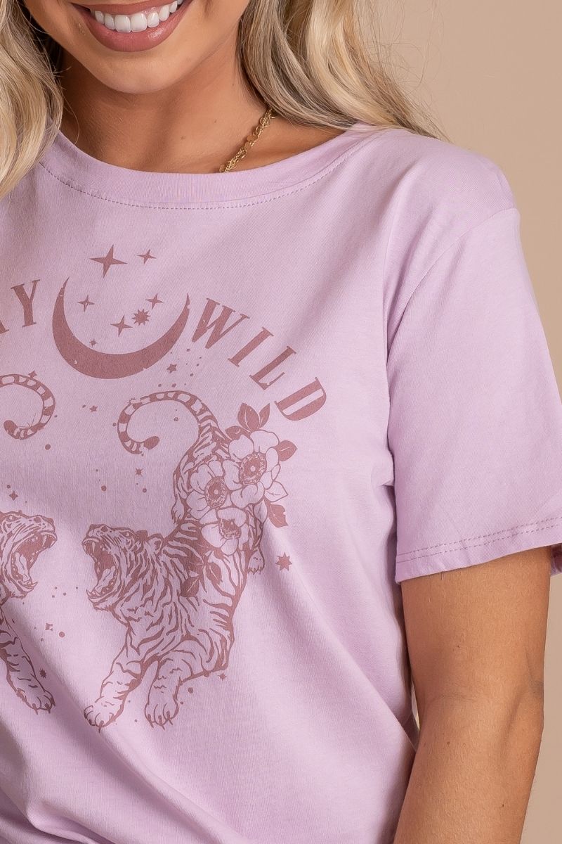 women's spring summer graphic tee in light purple with "stay wild" text and moon and stars 