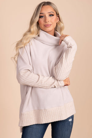 white turtleneck sweater with ribbed material on sleeves