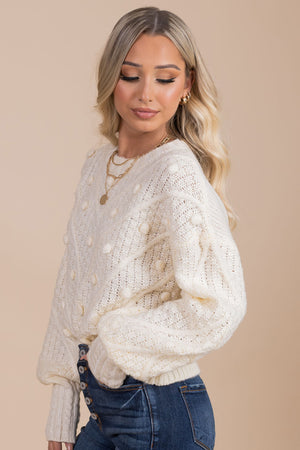 creamy off white sweater with textured polkadot and chevron striped details