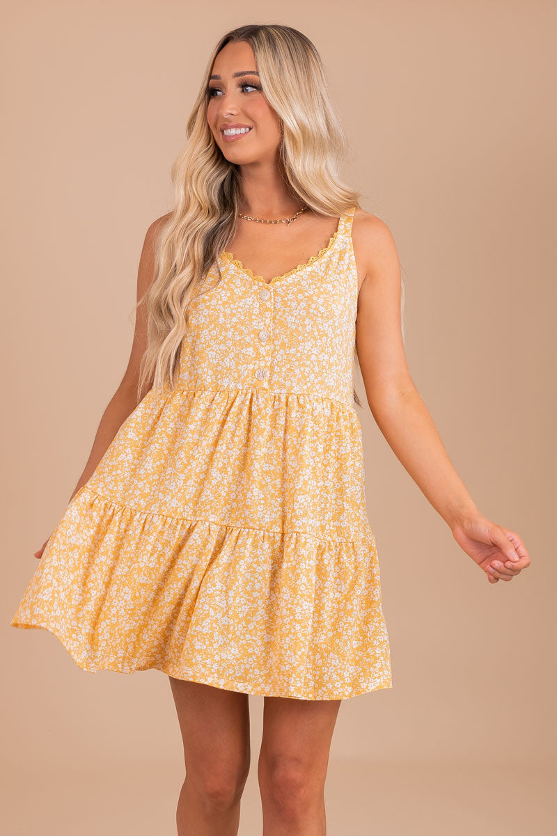 yellow floral mini dress with button front details